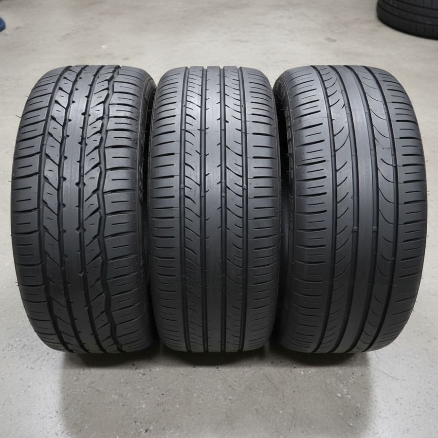 Close-up of a 200-treadwear autocross tire mounted on a lightweight wheel at an event